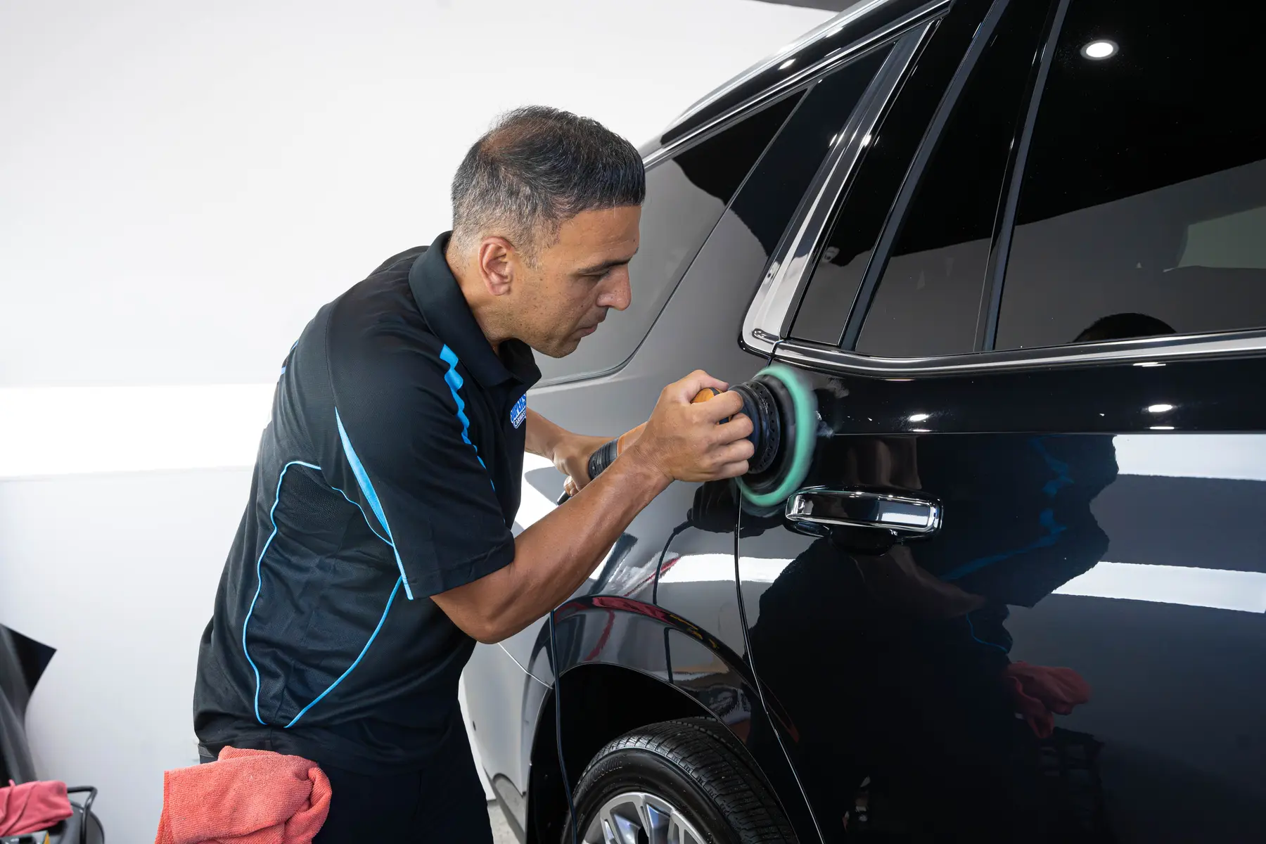 Machine polishing a dark panel